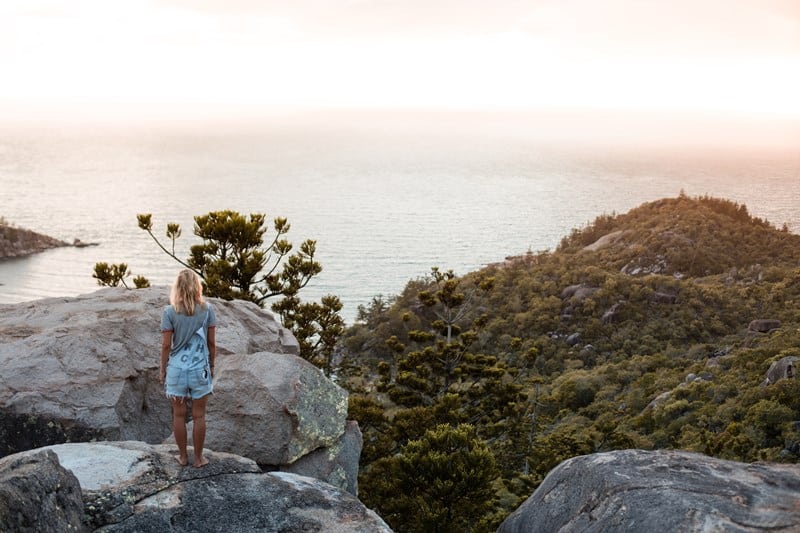 girl standing by a cliff-scenery