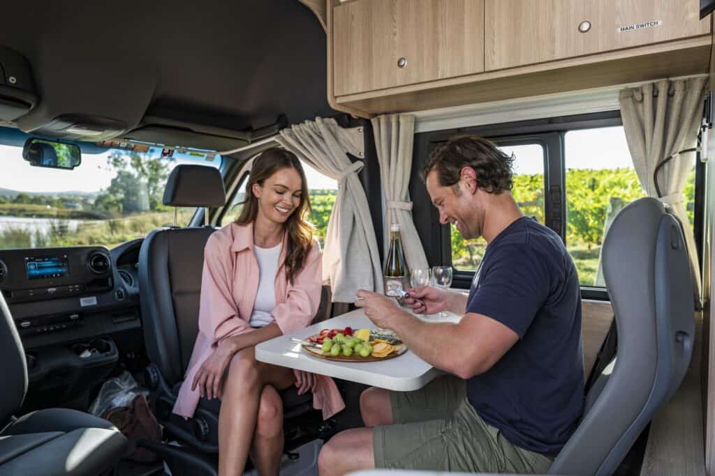 couple eating in a campervan